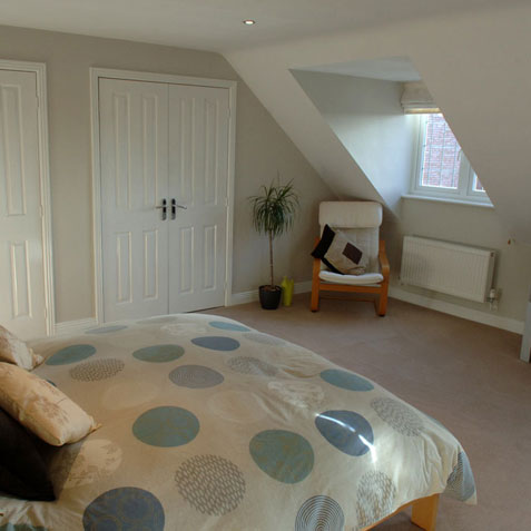 Loft conversion bedroom with dormer windows